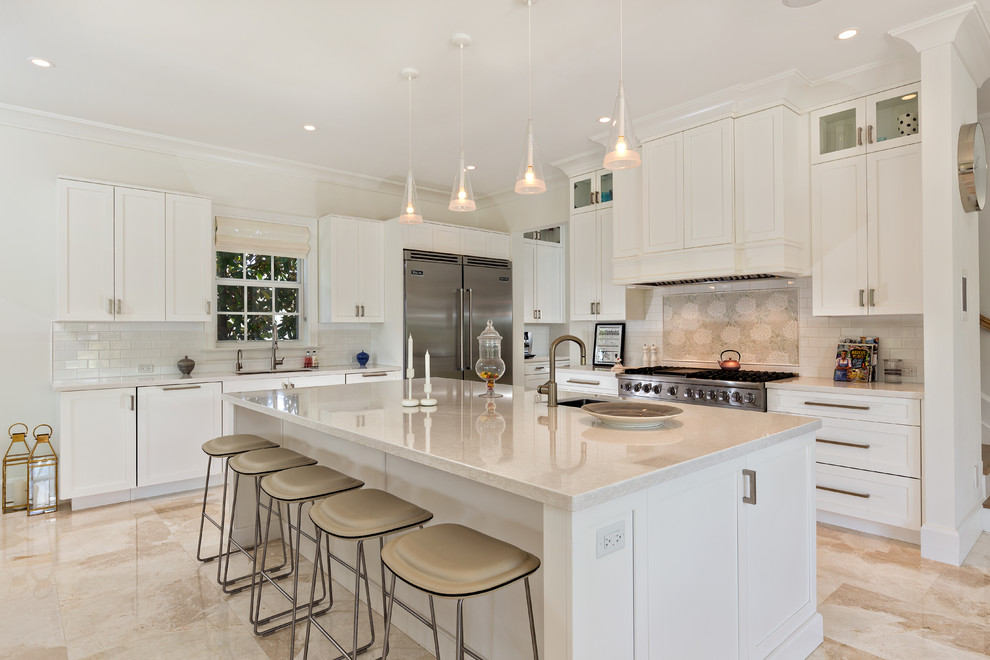 Photo of a large contemporary l-shaped open plan kitchen in Miami with an undermount sink, shaker cabinets, white cabinets, granite benchtops, white splashback, subway tile splashback, stainless steel appliances, marble floors and with island.