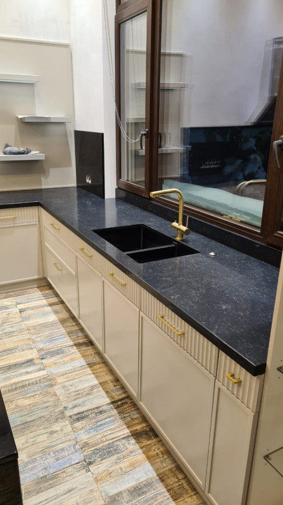 Mid-sized traditional kitchen in Other with quartz benchtops, black splashback, engineered quartz splashback, with island and black benchtop.