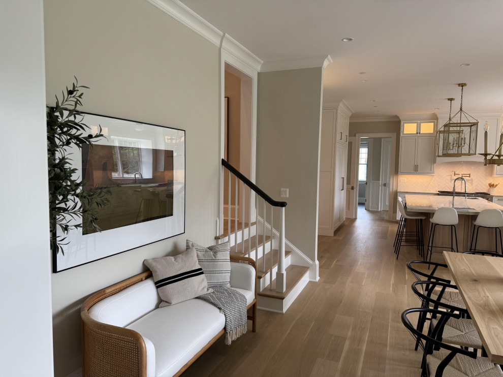 Inspiration for a large transitional wooden l-shaped wood railing staircase remodel in DC Metro with painted risers