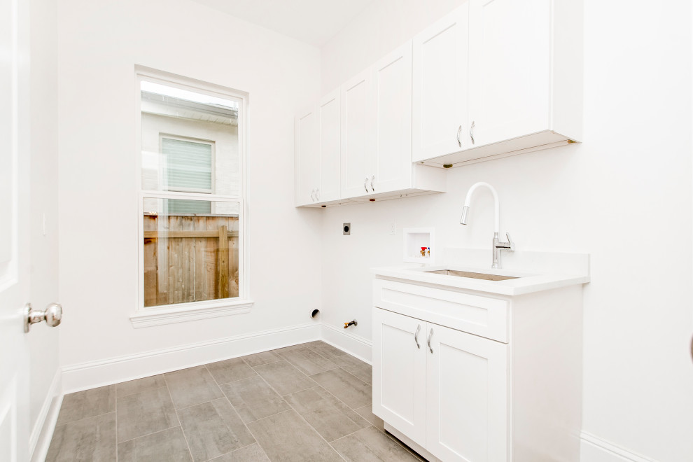 Example of a transitional laundry room design in New Orleans