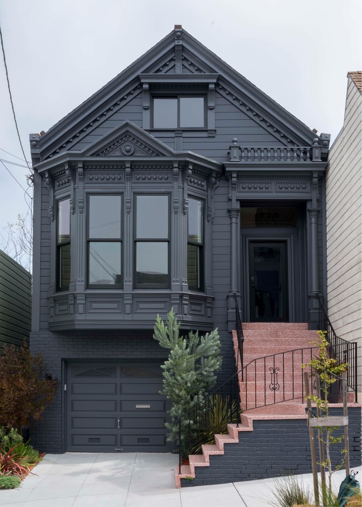 Design ideas for a large traditional three-storey black house exterior in San Francisco with a gable roof and mixed siding.