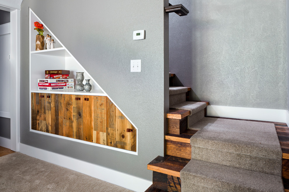Mid-sized mountain style walk-out carpeted and beige floor basement photo in Denver with gray walls