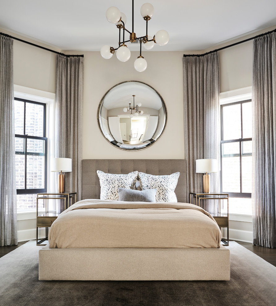 Photo of a mid-sized transitional master bedroom in Chicago with beige walls and dark hardwood floors.