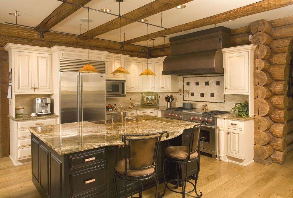 Design ideas for a mid-sized traditional l-shaped open plan kitchen in Seattle with a farmhouse sink, raised-panel cabinets, white cabinets, granite benchtops, beige splashback, stainless steel appliances, light hardwood floors and with island.