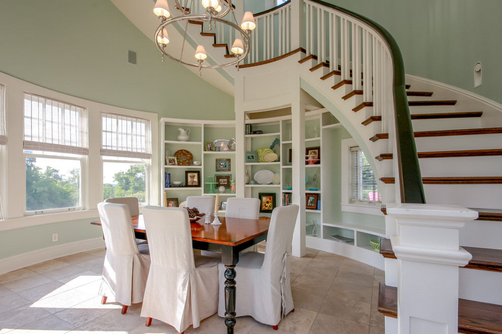 This is an example of a country dining room in Nashville with green walls and no fireplace.