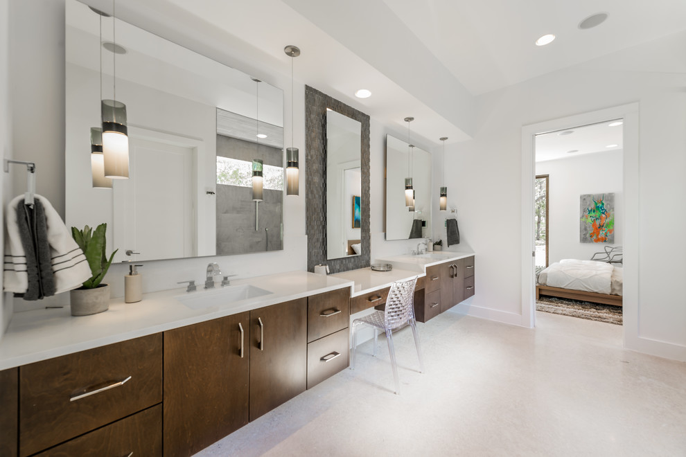 This is an example of a large contemporary master bathroom in Austin with an undermount sink, flat-panel cabinets, medium wood cabinets, solid surface benchtops, cement tile and white walls.