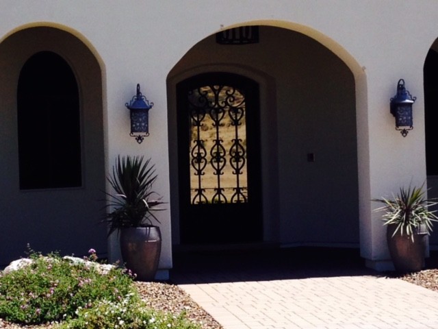 Inspiration for a large transitional front door remodel in Phoenix with white walls