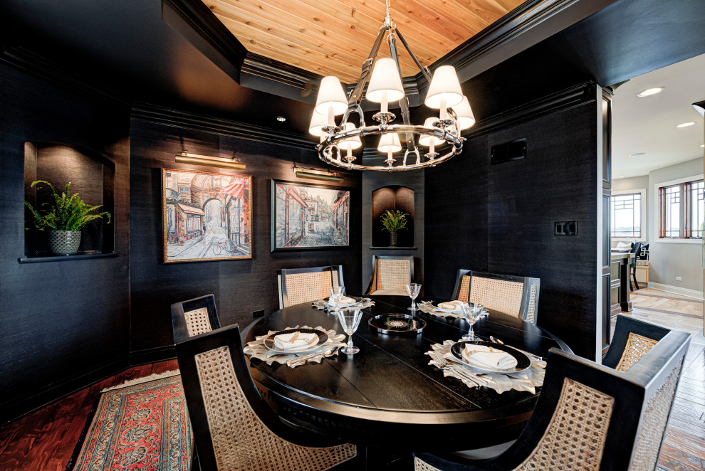 Photo of a medium sized bohemian enclosed dining room in Indianapolis with medium hardwood flooring, a timber clad ceiling and black walls.