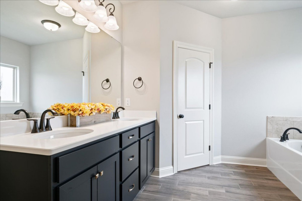Bathroom - mid-sized transitional master beige tile and cement tile ceramic tile, beige floor and double-sink bathroom idea with blue cabinets, gray walls, granite countertops, white countertops and a built-in vanity