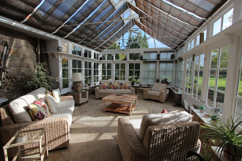 Inspiration for a traditional sunroom in Channel Islands with a glass ceiling.