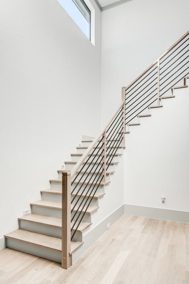 Mid-sized transitional wooden l-shaped wood railing staircase photo in Dallas with metal risers