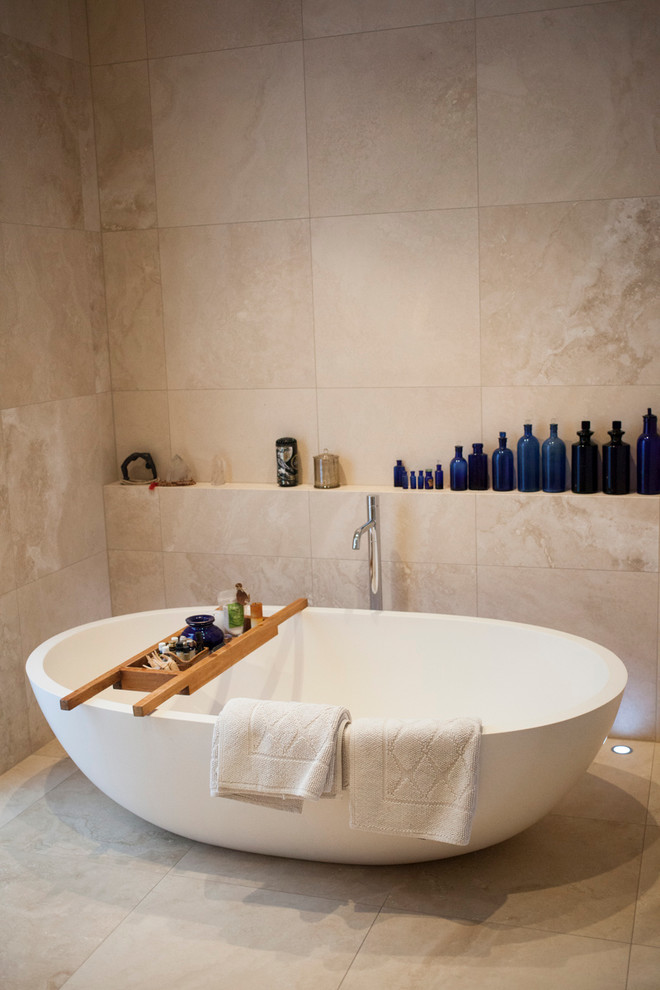 This is an example of a contemporary bathroom in Melbourne with a freestanding tub.