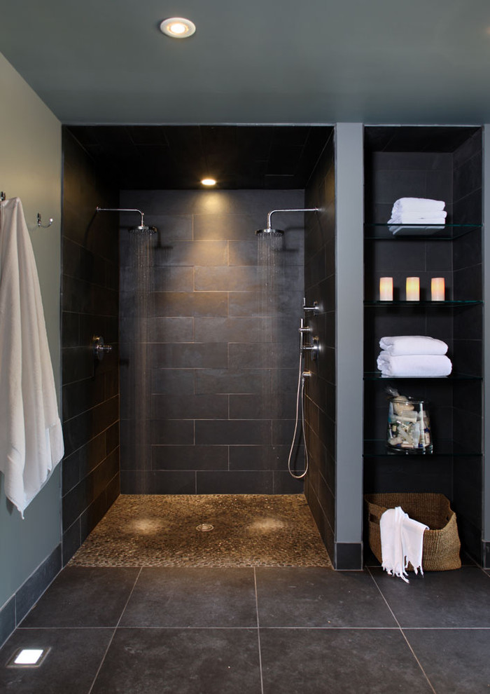 Design ideas for a contemporary bathroom in DC Metro with pebble tile floors and a double shower.