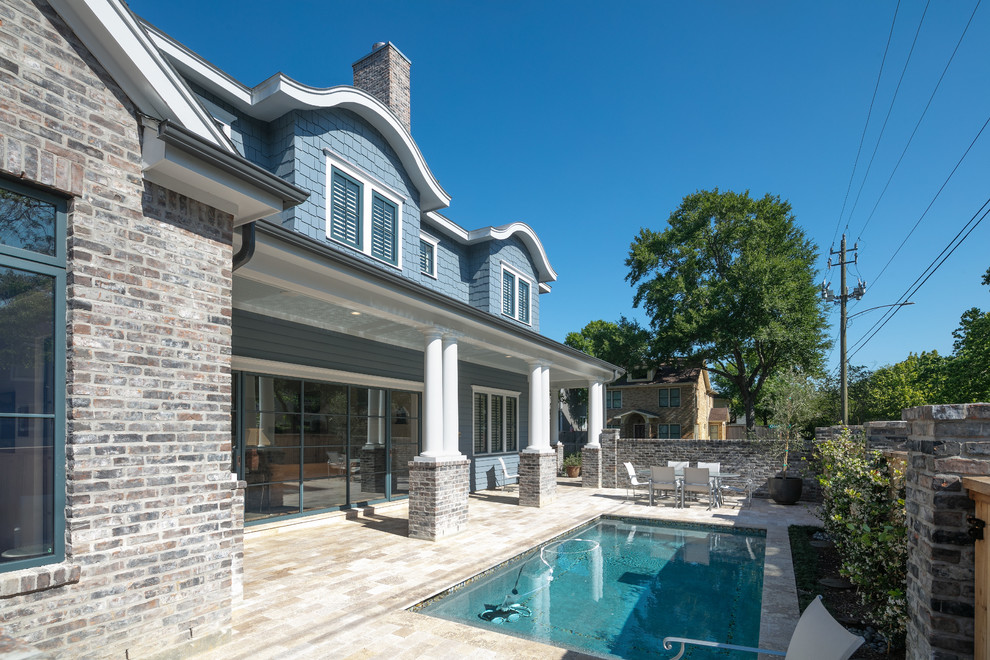 Example of a huge transitional backyard brick and rectangular pool fountain design in Houston
