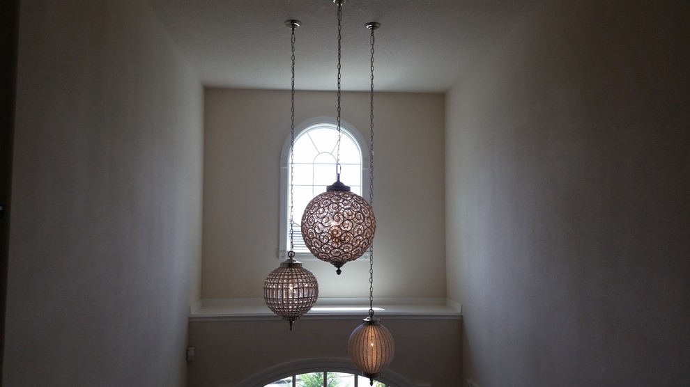 Inspiration for an expansive transitional foyer in Portland with white walls.