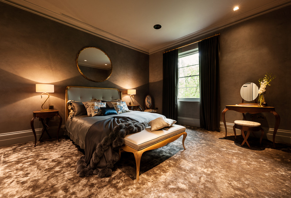 Transitional bedroom in London with brown walls and carpet.