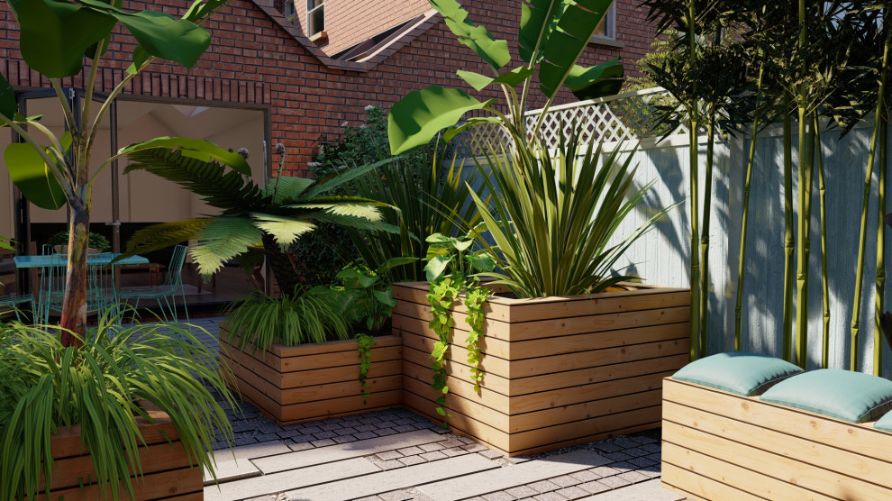 Ispirazione per un piccolo giardino boho chic esposto a mezz'ombra dietro casa in estate con pavimentazioni in pietra naturale e recinzione in legno