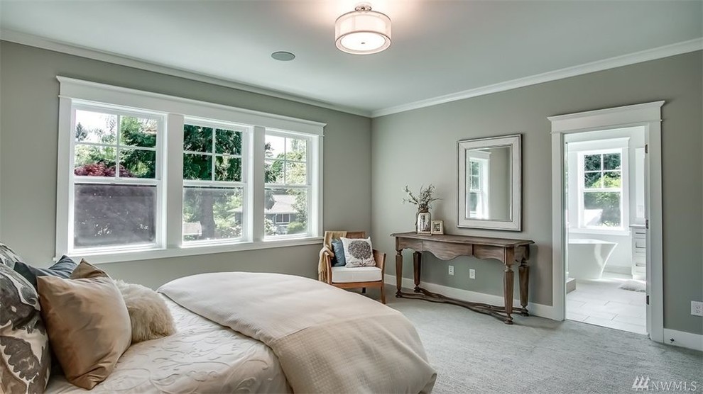 Photo of a large transitional bedroom in Seattle.
