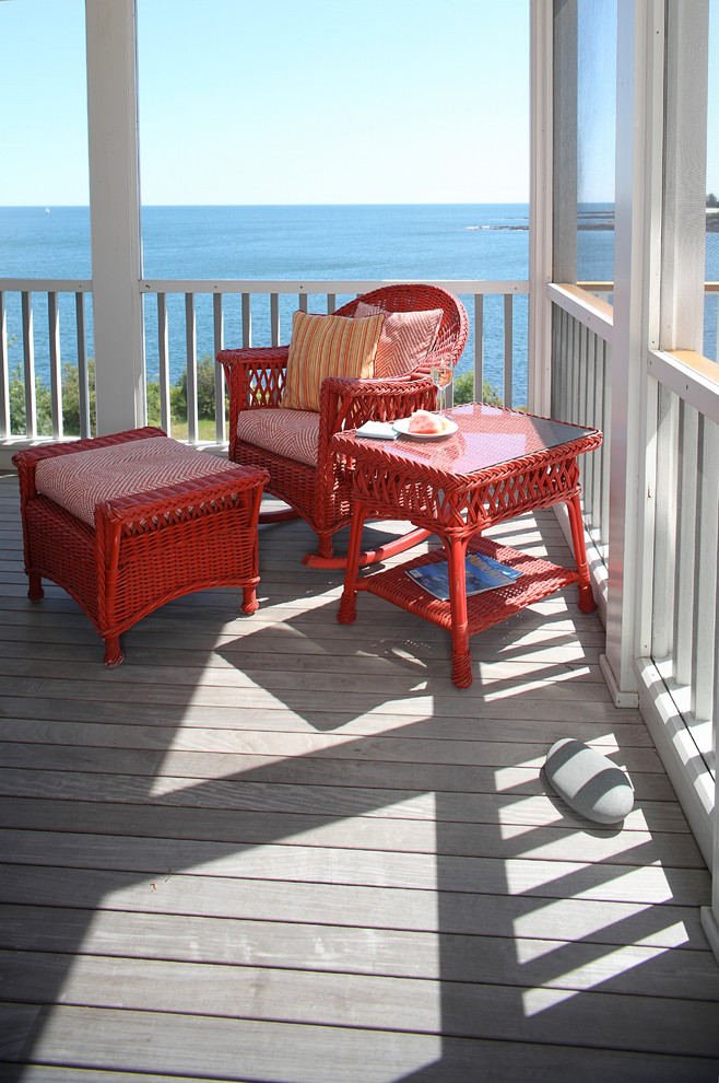 Photo of a mid-sized beach style balcony in Portland Maine with a roof extension.