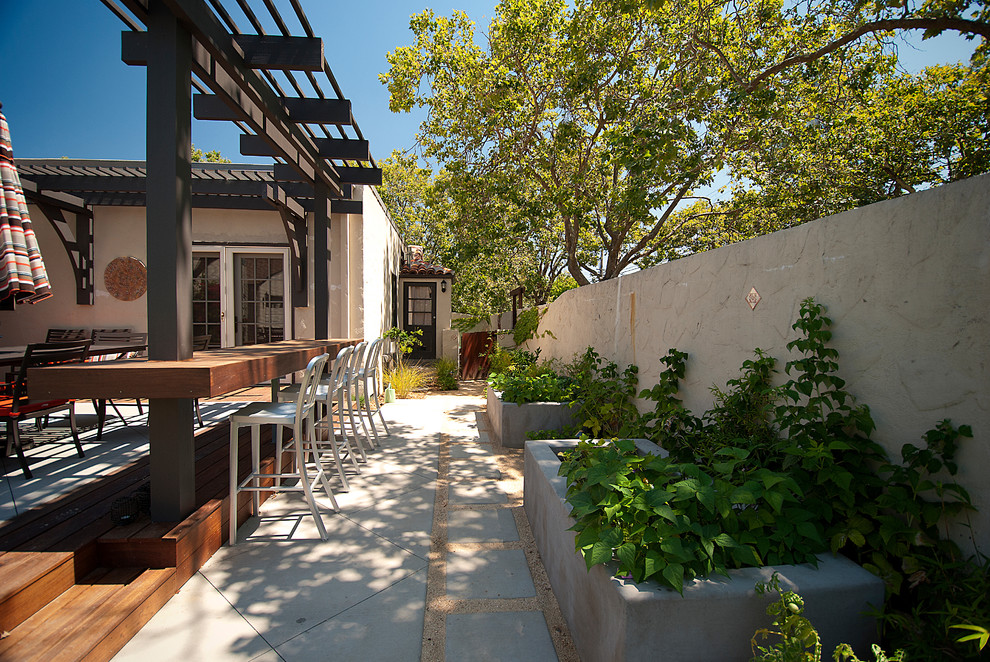 Inspiration for a mid-sized contemporary side yard patio in San Francisco with decking and a pergola.