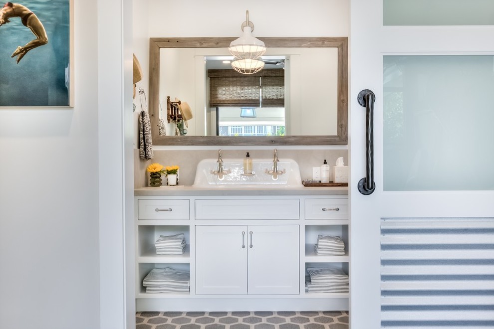 Inspiration for a large country powder room in Orange County with beaded inset cabinets, white cabinets, white walls, mosaic tile floors, a vessel sink and grey benchtops.