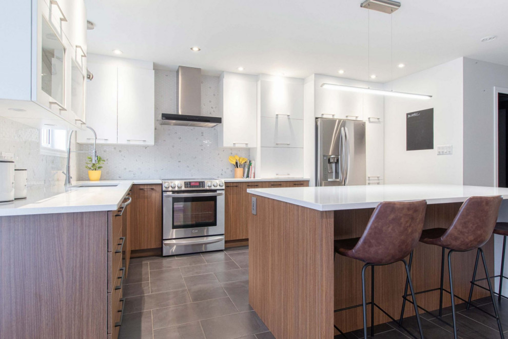 Inspiration for a large modern kitchen in Montreal with a drop-in sink, medium wood cabinets, granite benchtops, white splashback, marble splashback, stainless steel appliances, with island and white benchtop.