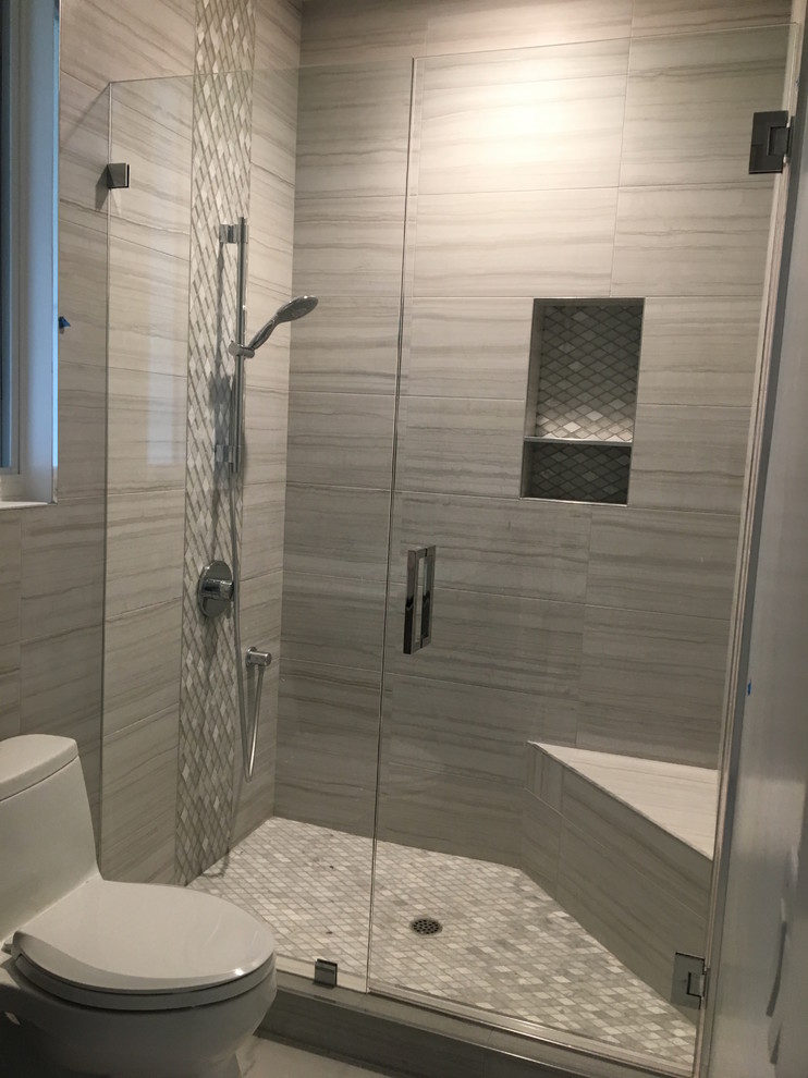 Photo of a large transitional master bathroom in Orange County with flat-panel cabinets, dark wood cabinets, glass tile, an integrated sink, a hinged shower door, a freestanding tub, a corner shower, white walls, ceramic floors and beige floor.