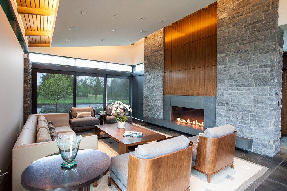 Design ideas for a large contemporary open concept living room in Vancouver with white walls, a ribbon fireplace, no tv, ceramic floors and a stone fireplace surround.