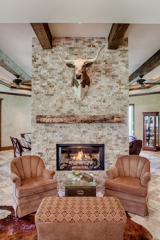 Design ideas for a country living room in Other with a two-sided fireplace.