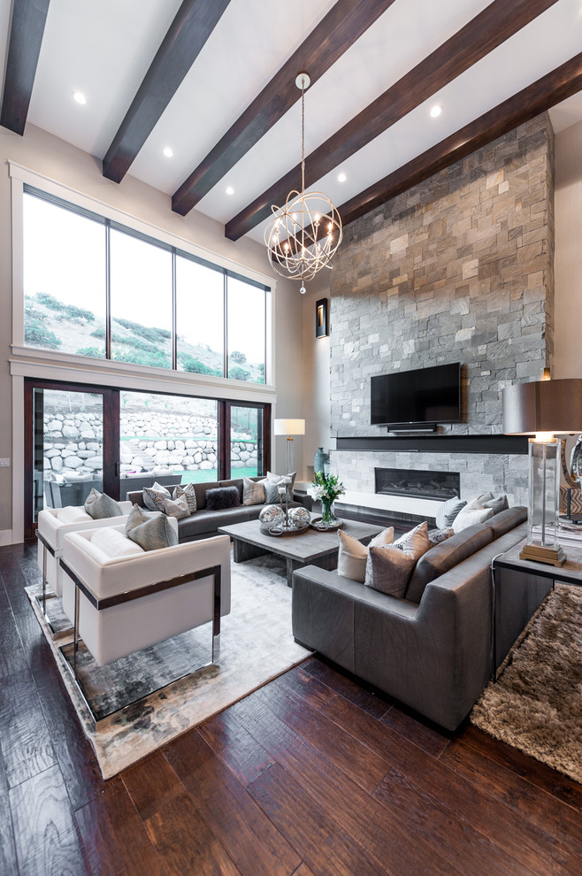 Mid-sized transitional open concept dark wood floor family room photo in Salt Lake City with gray walls, a standard fireplace, a stone fireplace and a wall-mounted tv