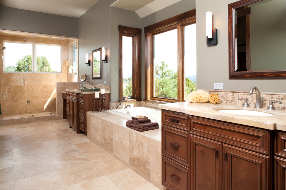 This is an example of a large traditional bathroom in Albuquerque with a drop-in tub.