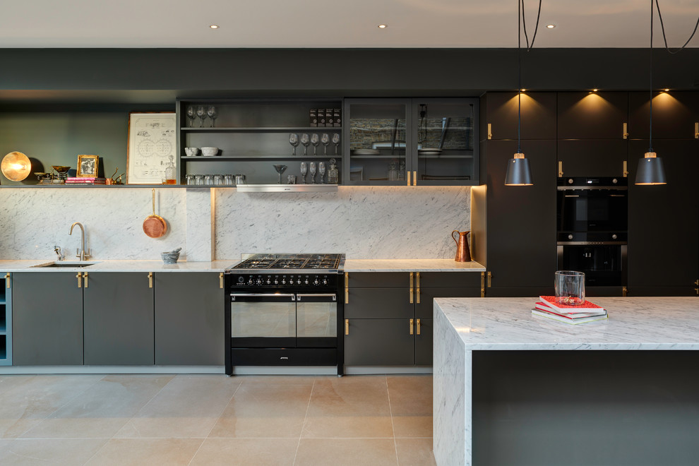 Photo of a mid-sized scandinavian single-wall kitchen in London with an undermount sink, flat-panel cabinets, grey cabinets, marble benchtops, grey splashback, marble splashback, black appliances, beige floor, grey benchtop and with island.