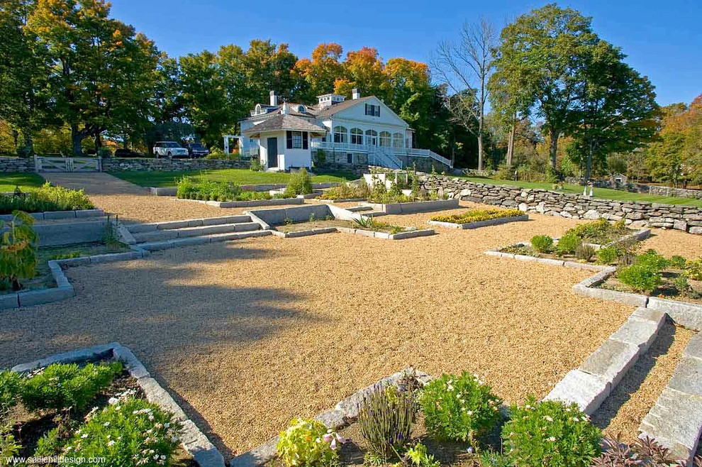 Design ideas for a large traditional backyard full sun formal garden for summer in Boston with gravel and a vegetable garden.