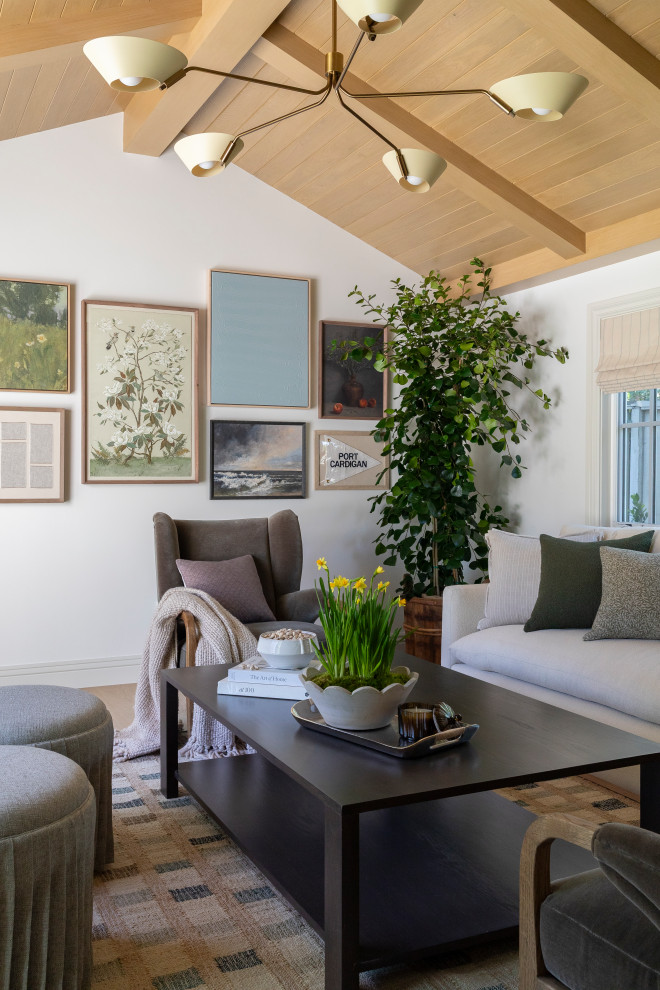 Example of a beach style vaulted ceiling living room design in Orange County