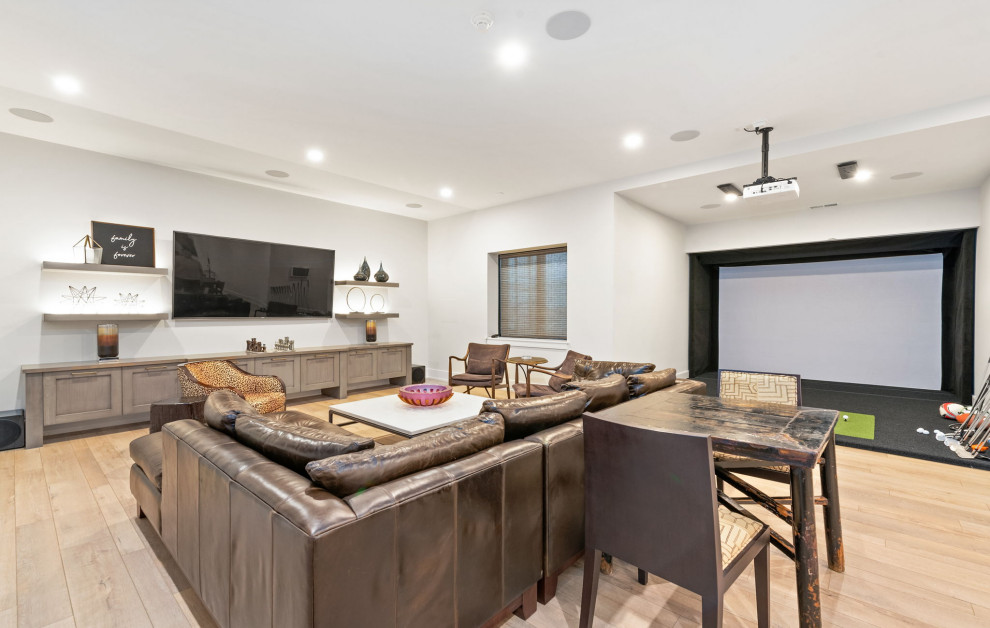 Large transitional underground vinyl floor and brown floor basement photo in Chicago with white walls