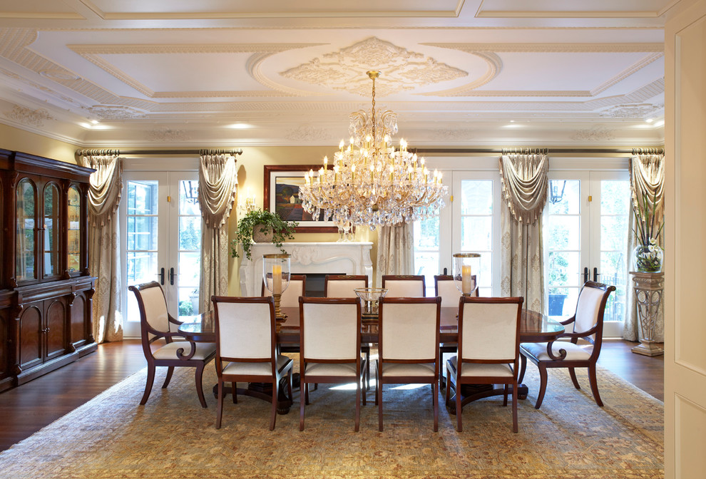 This is an example of a large traditional dining room in Toronto with dark hardwood floors.