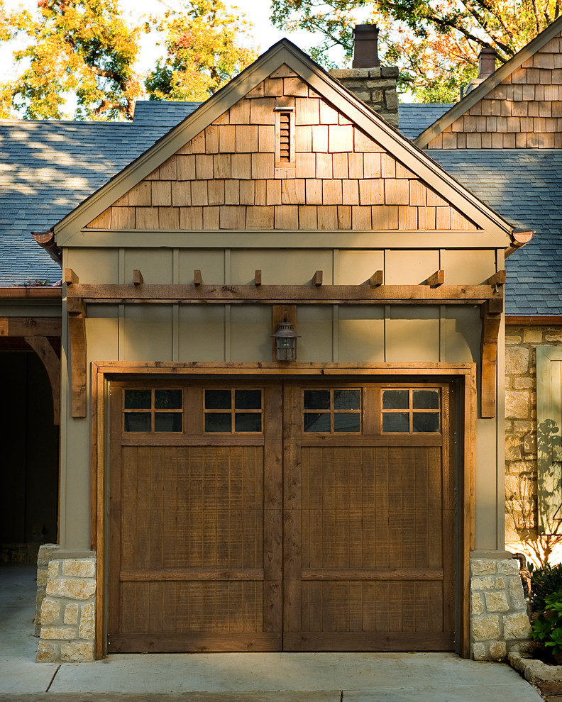 This is an example of a mid-sized transitional attached two-car garage in Other.