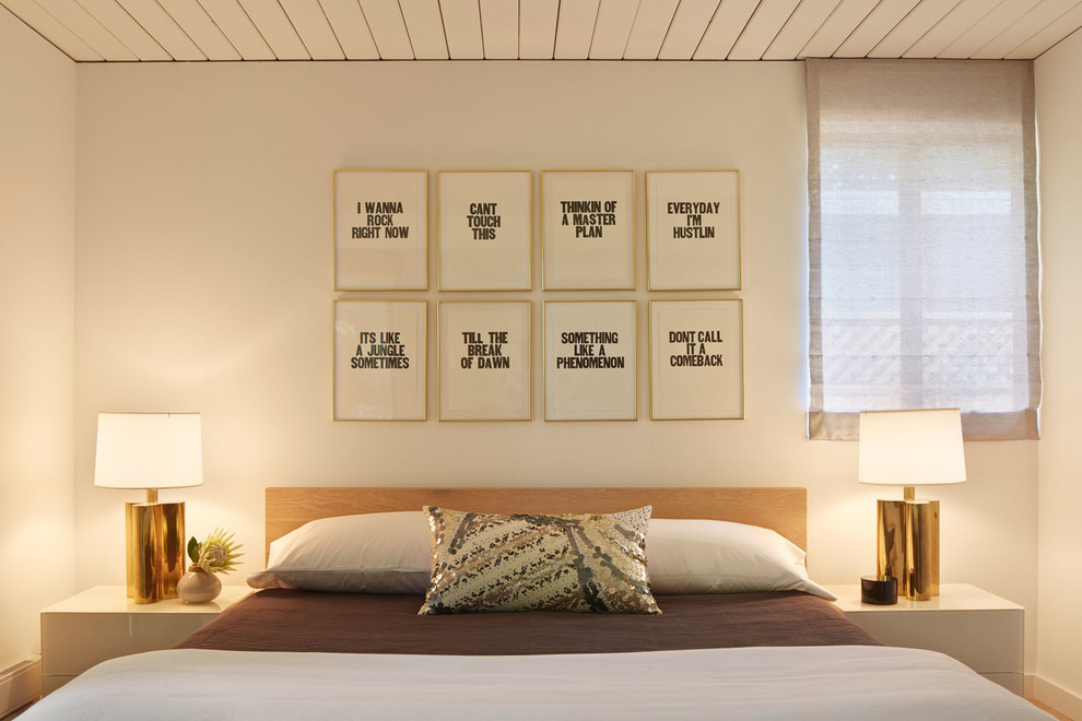 This is an example of a midcentury bedroom in San Francisco with white walls.