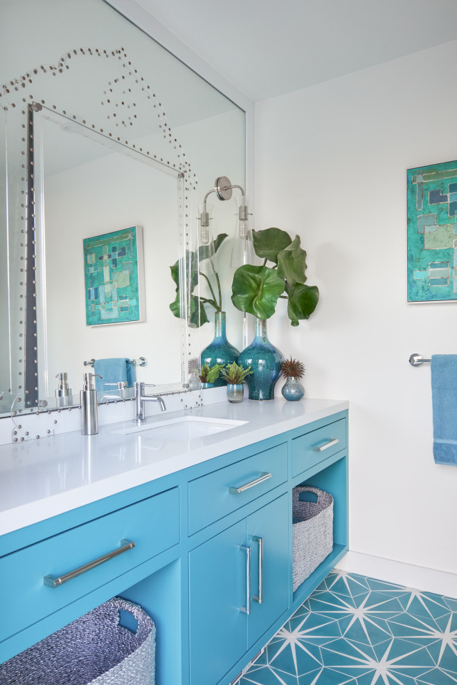 Design ideas for a mid-sized midcentury master bathroom in Los Angeles with flat-panel cabinets, turquoise cabinets, a curbless shower, a wall-mount toilet, white tile, porcelain tile, white walls, cement tiles, an undermount sink, engineered quartz benchtops, turquoise floor, a hinged shower door and white benchtops.