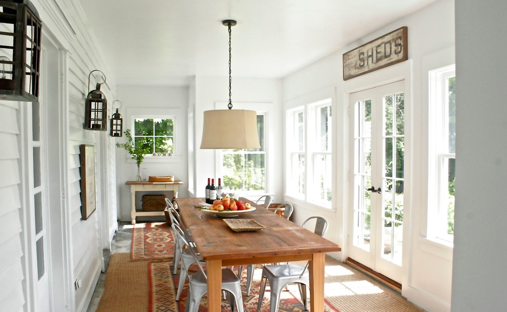 Photo of a beach style dining room in New York.