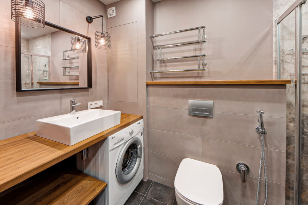 Example of a small urban 3/4 gray tile and porcelain tile porcelain tile, gray floor and single-sink bathroom design in Moscow with light wood cabinets, a wall-mount toilet, gray walls, a drop-in sink, wood countertops and beige countertops