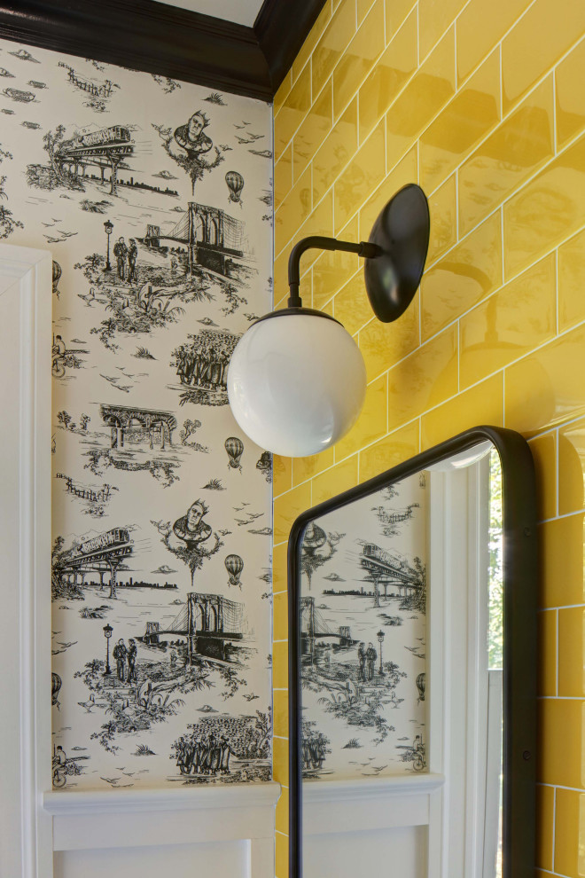 Photo of a small modern powder room in New York with flat-panel cabinets, white cabinets, a two-piece toilet, yellow tile, ceramic tile, white walls, porcelain floors, an integrated sink, grey floor, a floating vanity and wallpaper.