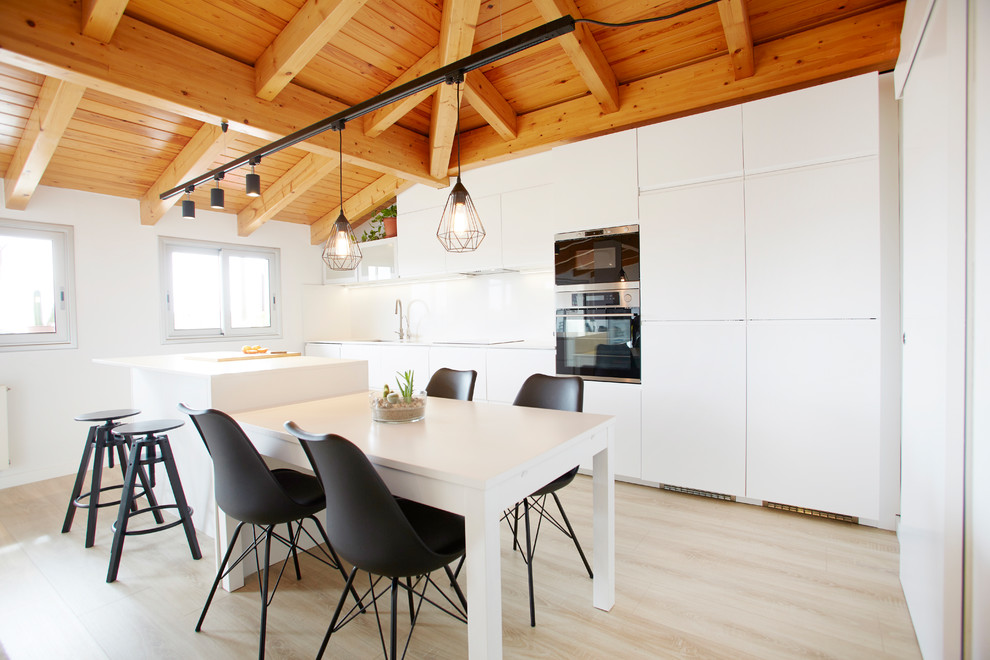 Design ideas for a mid-sized scandinavian single-wall eat-in kitchen in Other with flat-panel cabinets, white cabinets, white splashback, light hardwood floors, with island and beige floor.