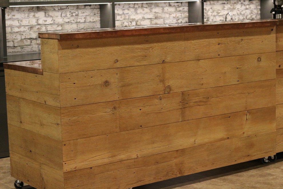Home bar - large rustic u-shaped vinyl floor and beige floor home bar idea with an undermount sink, shaker cabinets, gray cabinets, quartzite countertops, white backsplash, brick backsplash and black countertops