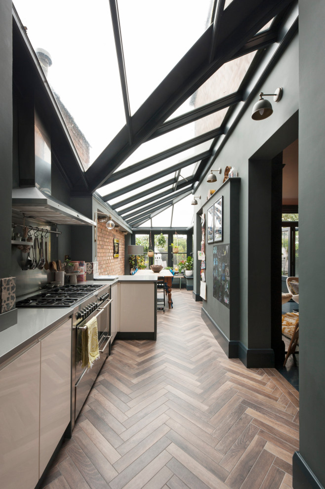 Inspiration for a traditional galley eat-in kitchen in Los Angeles with medium hardwood floors and vaulted.