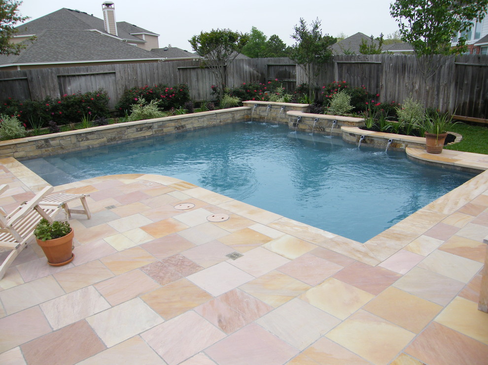Mid-sized transitional backyard tile and custom-shaped pool fountain photo in Houston