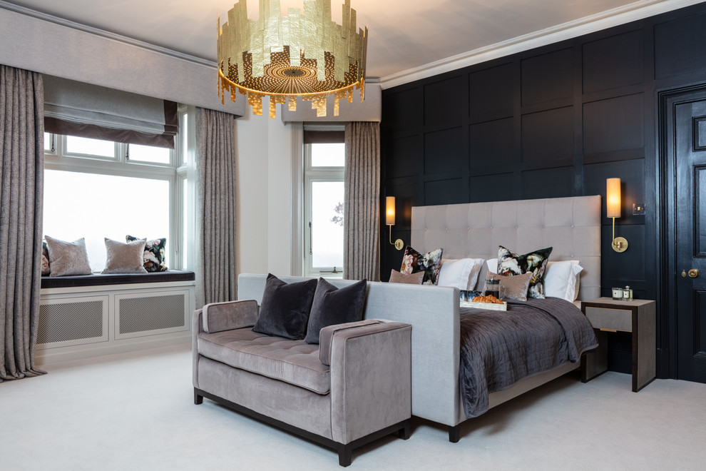 Design ideas for a transitional master bedroom in Sussex with black walls, carpet and grey floor.