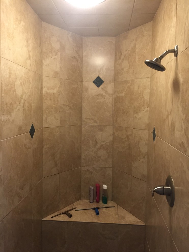 Example of a large beige tile and travertine tile doorless shower design in Denver