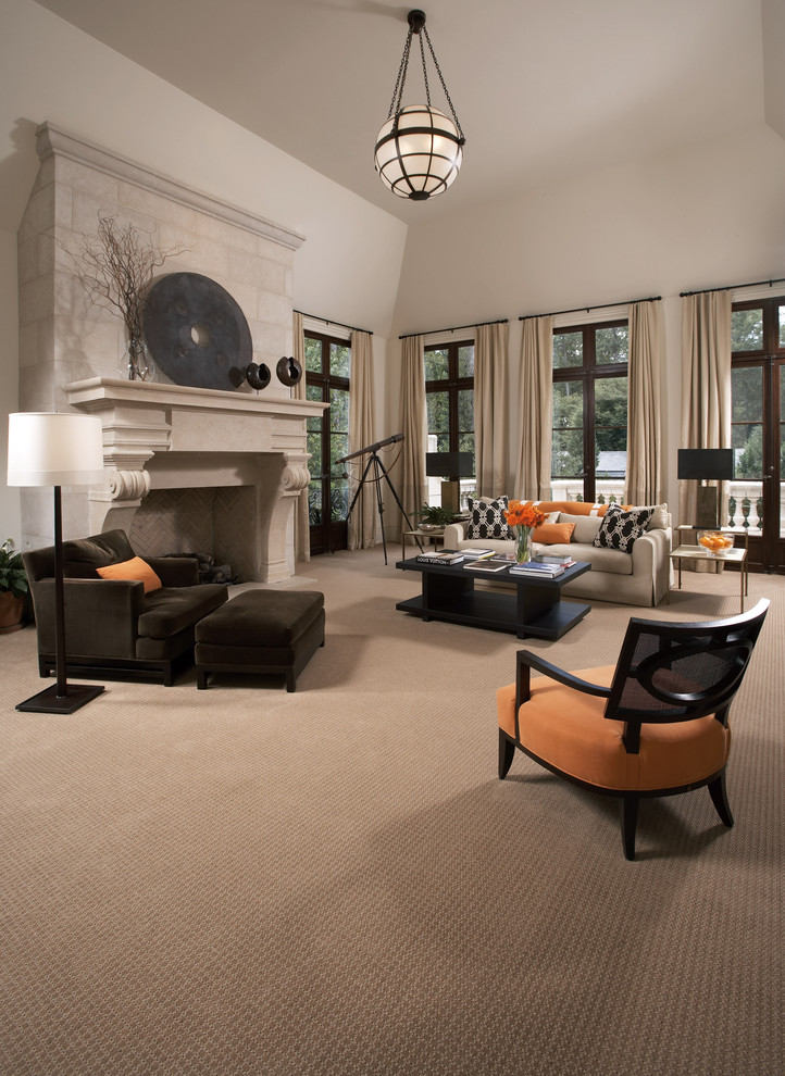 Large contemporary formal enclosed living room in Boston with beige walls, carpet, a standard fireplace, a plaster fireplace surround and beige floor.