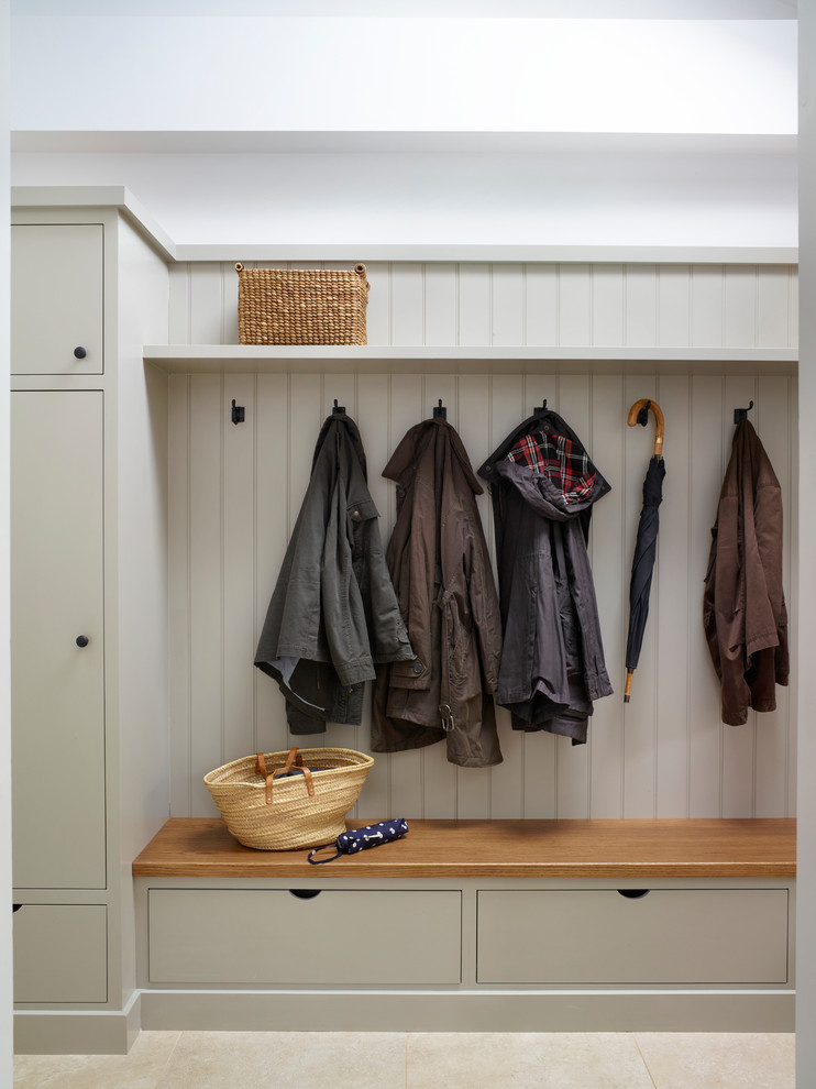 Inspiration for a traditional laundry room in Other with flat-panel cabinets.